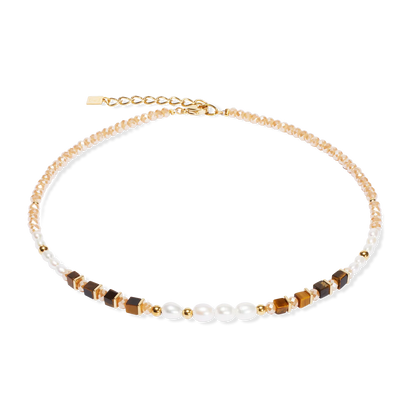 Necklace with gold, brown, and white beads on a white background