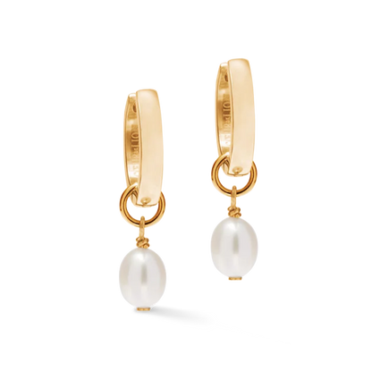 Gold hoop earrings with pearl drops on a white background