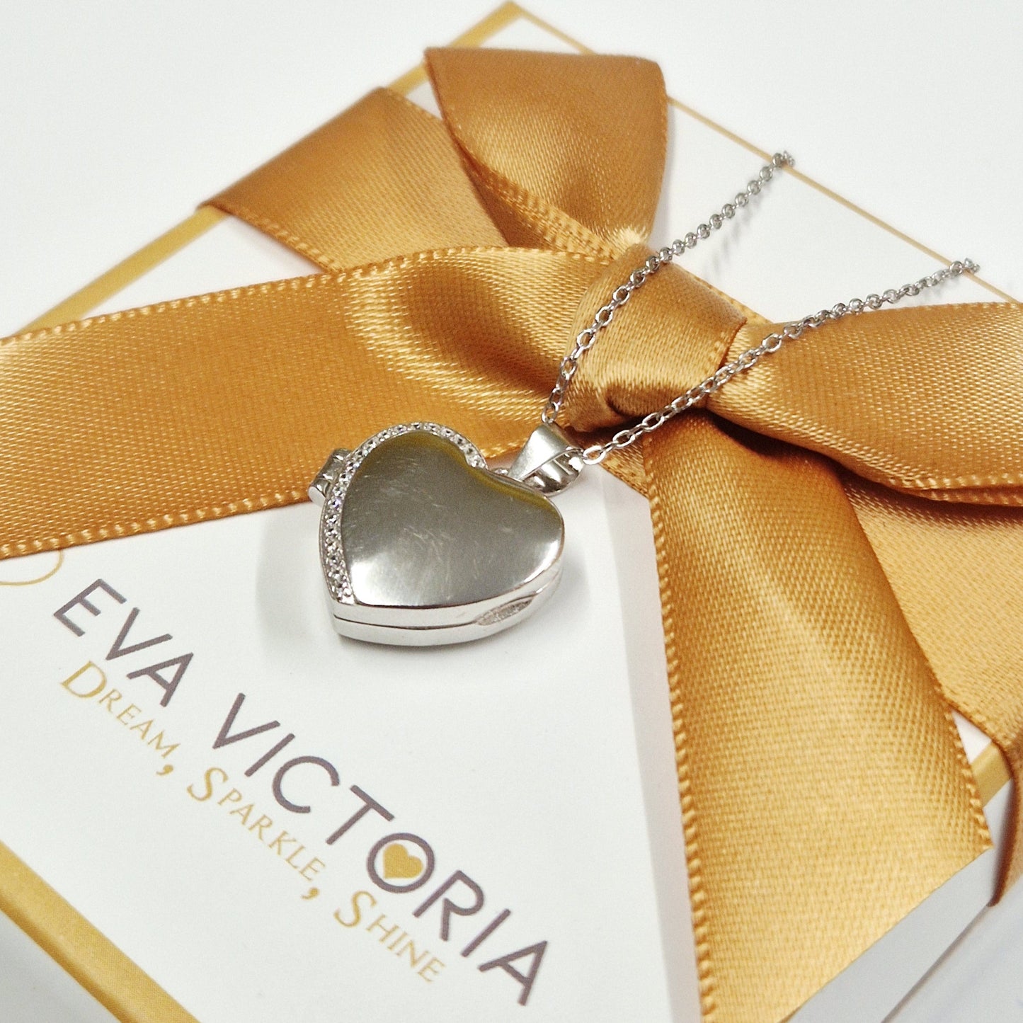 Close-up of Sterling Silver Heart Photo Locket with Engraving Option