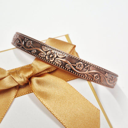 Close up of Adjustable copper magnetic therapy bangle by Eva Victoria