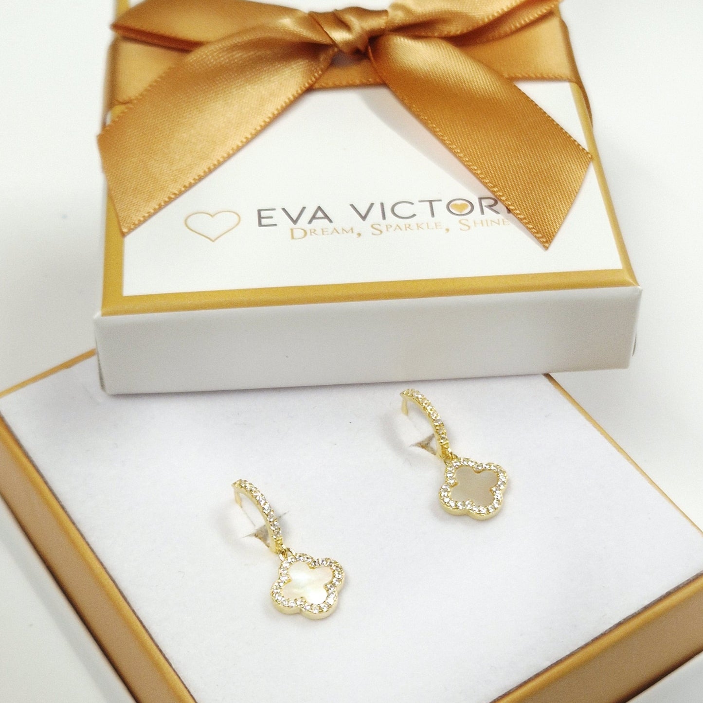 elegant gold clover hoop earrings in eva victoria gift box