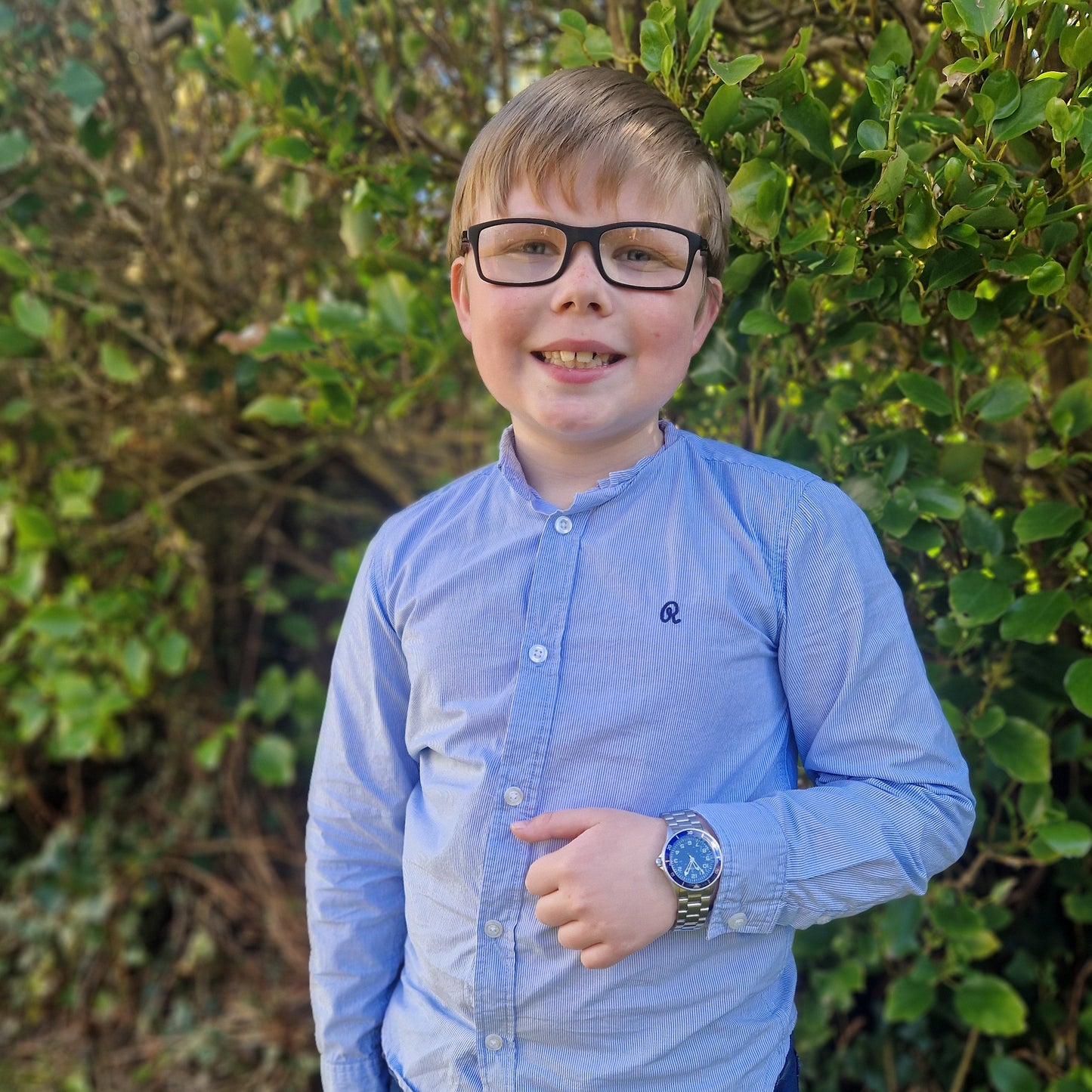 blue stainless steel watch on boys wrist - eva victoria ireland