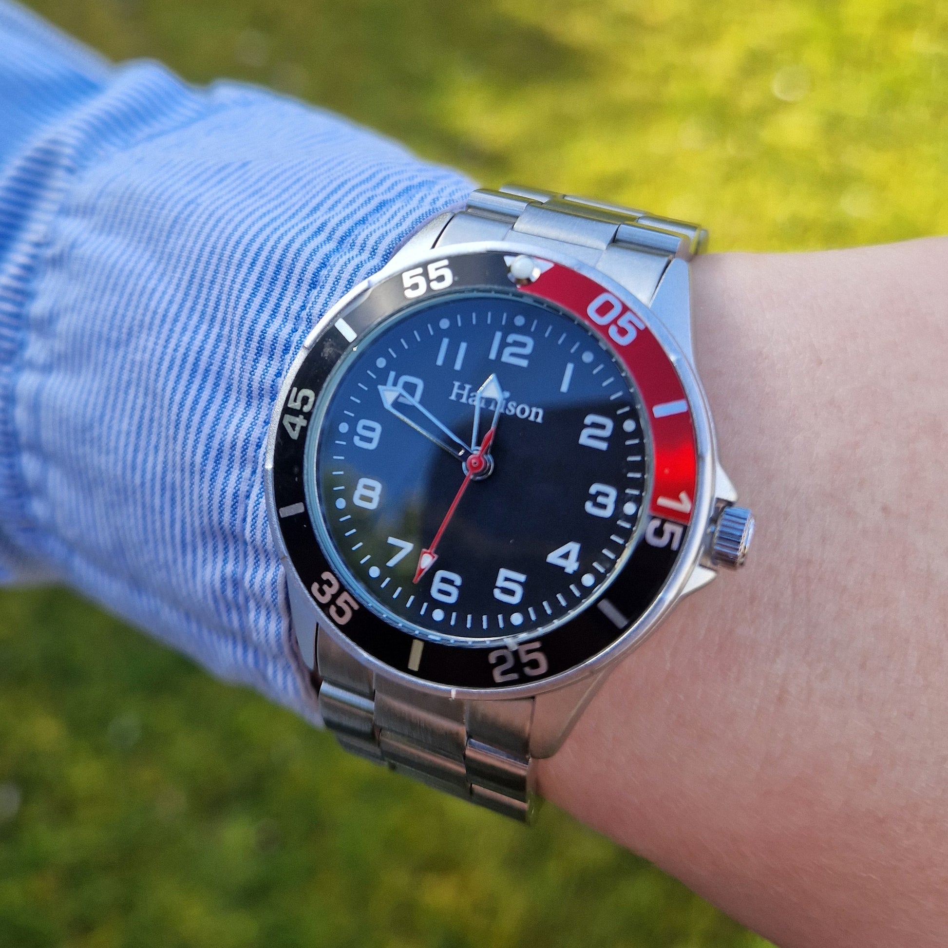 black and red sports silver watch on model wrist - eva victoria ireland
