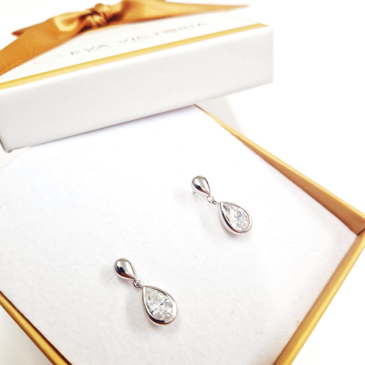 Sterling silver cubic zirconia teardrop drop earrings with butterfly stud clasps, 18mm long