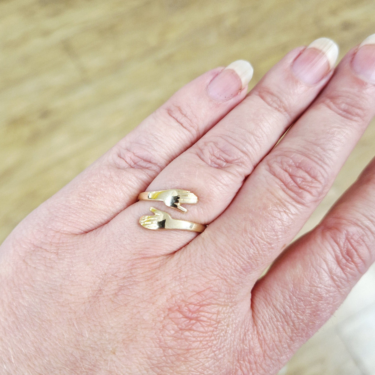9ct yellow gold hug ring on hand model