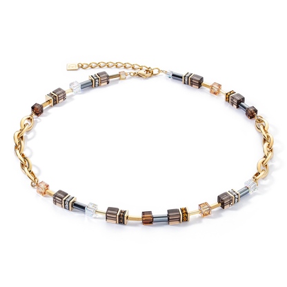 Gold and silver cube necklace on a white background