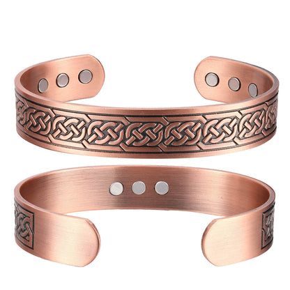 Two copper bracelets with Celtic knot designs 