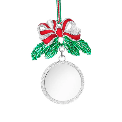 Christmas ornament with a red bow and pine leaves on a white background