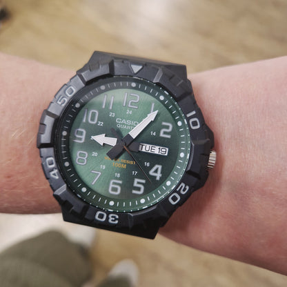 Casio MRW-210H-3BV Green Dial Watch on wrist