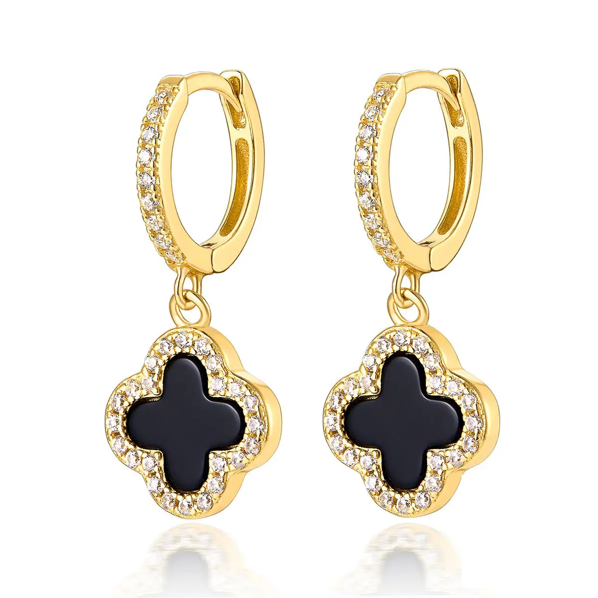 Gold hoop earrings with black clover-shaped charms on a white background