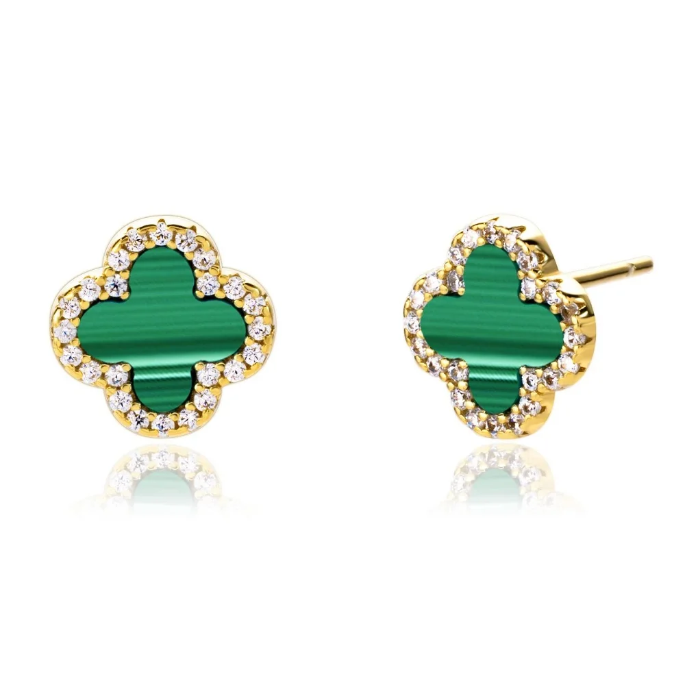 Green clover-shaped earrings with gold and clear stone accents on a white background