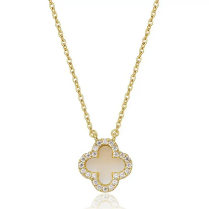 Gold necklace with a clover-shaped pendant on a white background