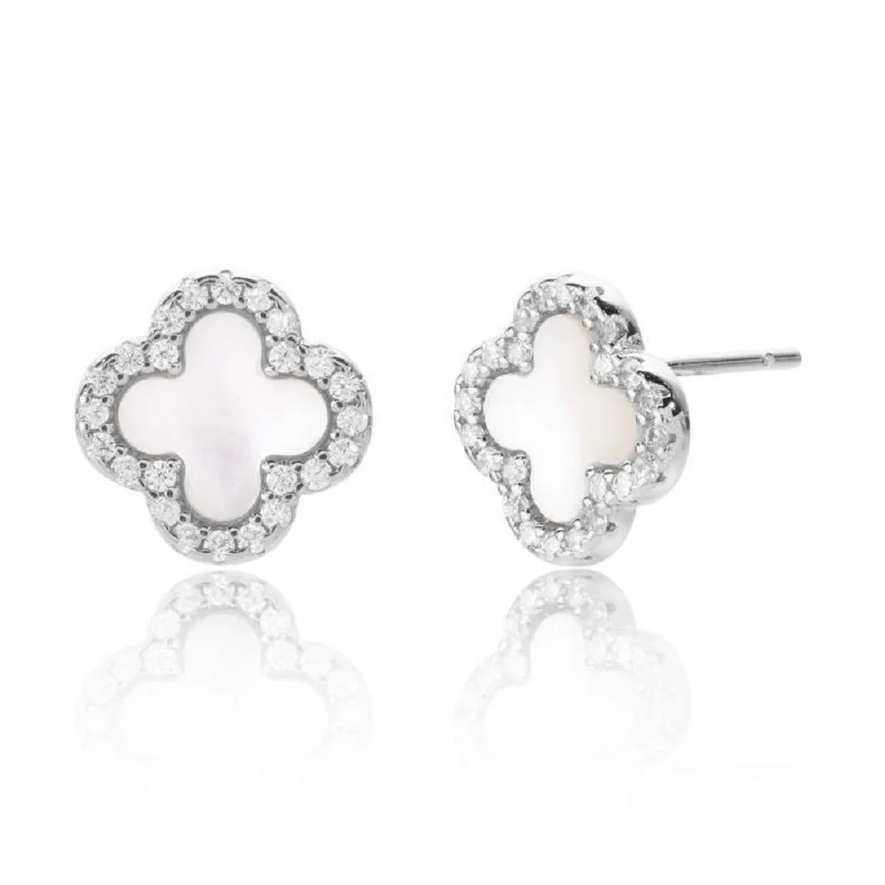 Pair of silver earrings with white center on a white background