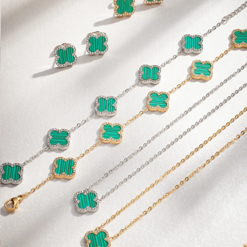 Necklace with green clover-like pendants on a white background