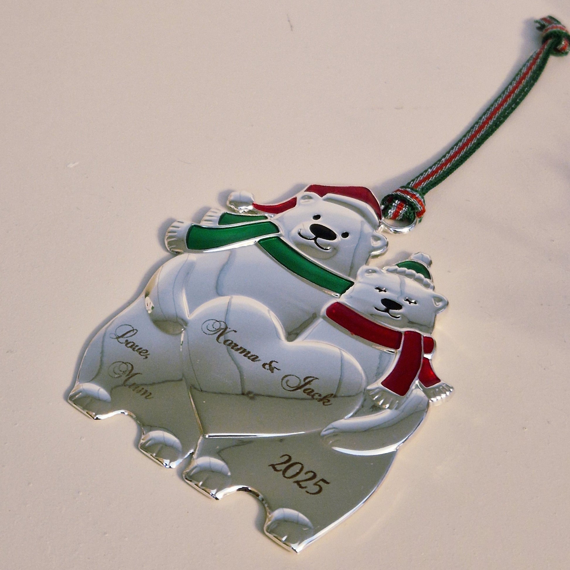 Christmas ornament with polar bears couple design on a plain background