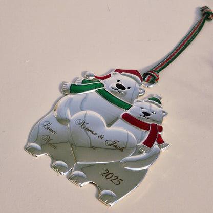 Christmas ornament with polar bears couple design on a plain background