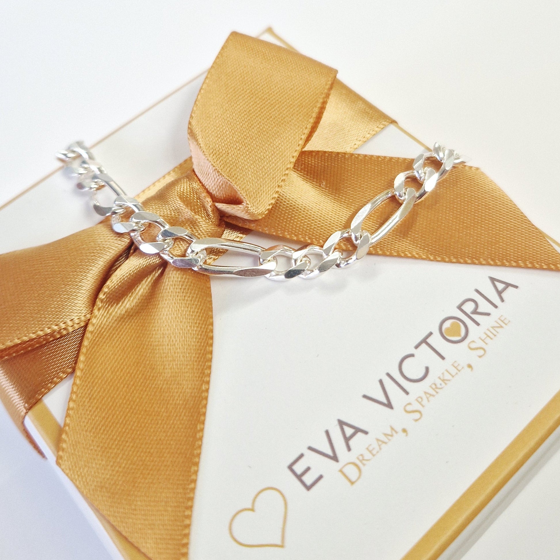 silver figaro bracelet closeup