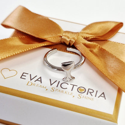 Eva Victoria chalice religeous ring in a white box with a gold ribbon on a light gray background