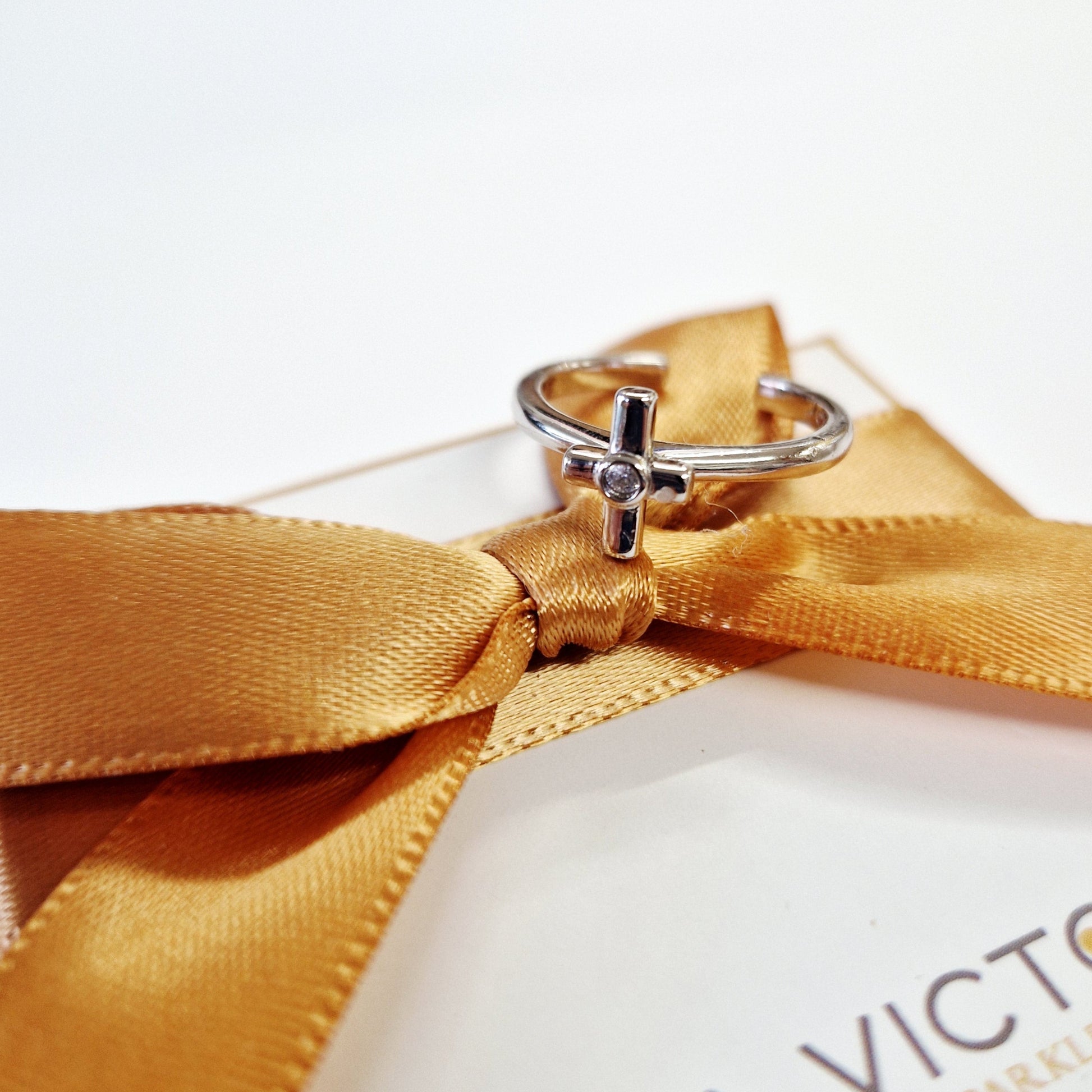 silver cross on ring design